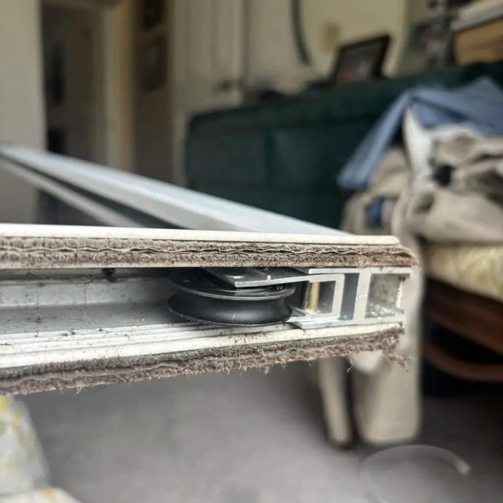 Replacing rollers on a sliding door in poor condition